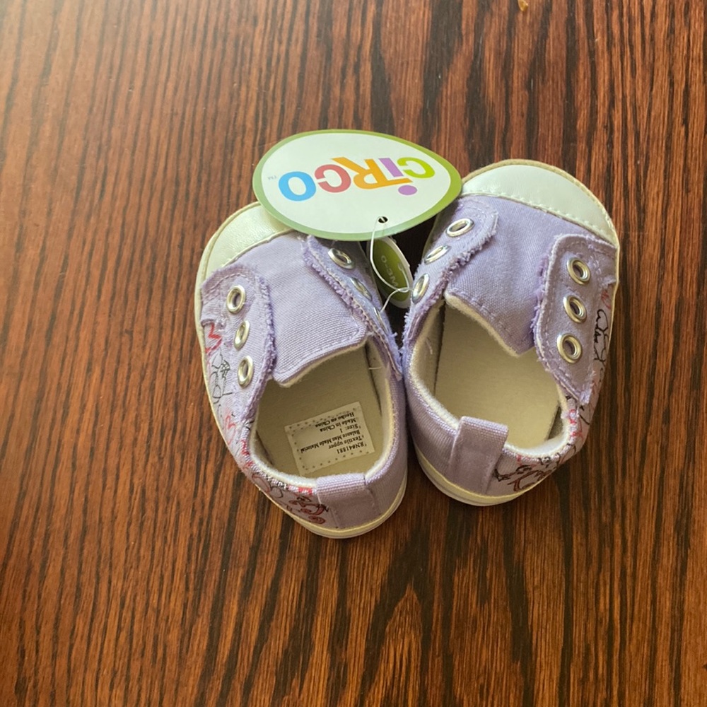 Purple sneakers with pink red and black hearts